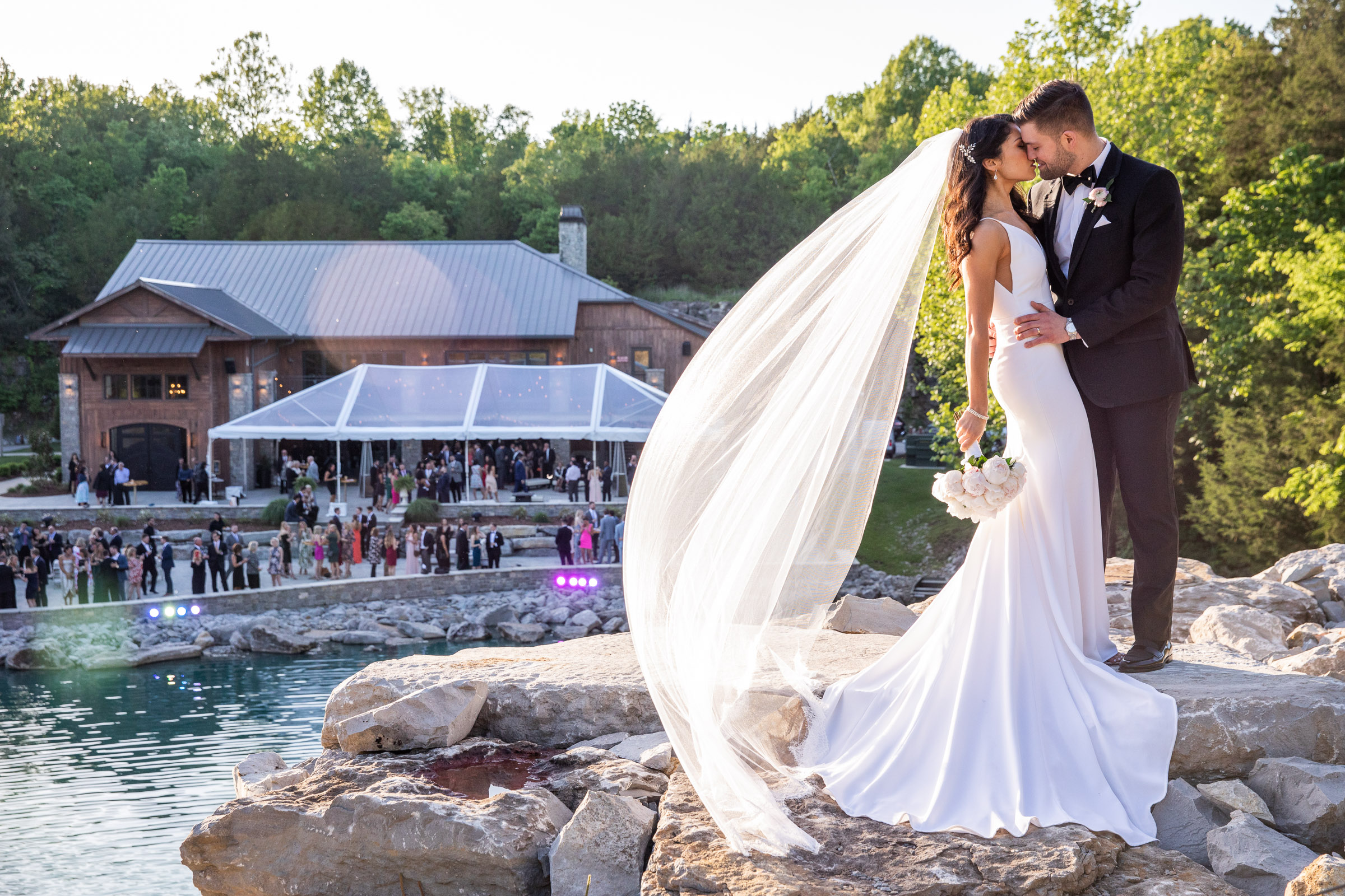 Graystone Quarry Bride & Groom on top of the water fall